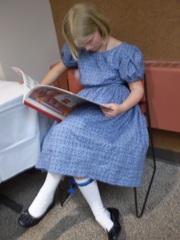 Julia in 1860's dress sewn by mom, Lorraine, with garter stockings also knitted by mom.